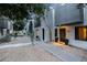 Contemporary townhome with corrugated metal and stucco, showcasing the entrance and low-maintenance yard at 7857 N 21St Ave, Phoenix, AZ 85021