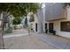Modern townhome showcasing a concrete walkway, minimalist landscaping and corrugated metal exterior at 7857 N 21St Ave, Phoenix, AZ 85021