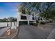 Townhome featuring a private garage, small balconies, and dark-framed windows creating a modern appearance at 7857 N 21St Ave, Phoenix, AZ 85021