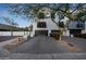 Townhome featuring a private garage, small balconies, and dark-framed windows creating a modern appearance at 7857 N 21St Ave, Phoenix, AZ 85021