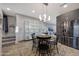 Eat-in kitchen boasting gray cabinets and direct access to the living room at 7857 N 21St Ave, Phoenix, AZ 85021