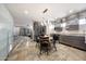 Modern kitchen boasts sleek cabinets, stainless steel appliances, and a cozy breakfast nook with stylish rug at 7857 N 21St Ave, Phoenix, AZ 85021