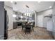 Contemporary kitchen featuring gray cabinets, stainless steel appliances, and a stylish dining area at 7857 N 21St Ave, Phoenix, AZ 85021