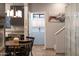 Inviting kitchen featuring gray cabinets, a farmhouse sink, an adjacent dining area, and access to other living spaces at 7857 N 21St Ave, Phoenix, AZ 85021
