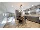 Modern kitchen boasts sleek cabinets, stainless steel appliances, and a cozy breakfast nook with stylish rug at 7857 N 21St Ave, Phoenix, AZ 85021