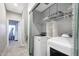 Functional laundry room with washer, dryer, shelving, and ample space for storage at 7857 N 21St Ave, Phoenix, AZ 85021