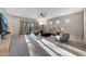 Sun-filled living room with plush carpet, modern furniture, and sliding glass doors at 7857 N 21St Ave, Phoenix, AZ 85021