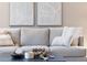 Cozy living room featuring a comfortable sofa, decorative pillows, and stylish decor with natural textures and colors at 7857 N 21St Ave, Phoenix, AZ 85021