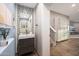 Stylish powder room with a unique vessel sink, mosaic tile backsplash, and access to the main living area at 7857 N 21St Ave, Phoenix, AZ 85021
