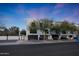 Street view of modern townhomes featuring private garages, small balconies, and a contemporary design at 7857 N 21St Ave, Phoenix, AZ 85021