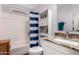 Bathroom with modern vanity, tiled floors, and a shower-tub combination at 8209 E 5Th Ave, Mesa, AZ 85208