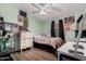 bedroom featuring laminate flooring, white dresser, and fun décor at 8209 E 5Th Ave, Mesa, AZ 85208