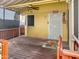 Cozy front porch featuring a ceiling fan, secure door, and a screen window providing natural light at 8209 E 5Th Ave, Mesa, AZ 85208