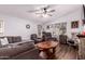 Spacious living room featuring a stone fireplace and plenty of seating with natural light at 8209 E 5Th Ave, Mesa, AZ 85208