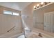 Well-lit bathroom featuring a shower-tub combination, vanity and tile flooring at 825 E Michigan Ave, Phoenix, AZ 85022