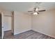 A bright bedroom with wood floors and a ceiling fan at 825 E Michigan Ave, Phoenix, AZ 85022