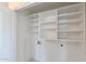 Walk-in closet with built-in shelving at 825 E Michigan Ave, Phoenix, AZ 85022