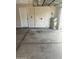 Clean garage interior features a water heater and a convenient exit door at 825 E Michigan Ave, Phoenix, AZ 85022