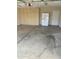 Spacious garage features ample storage cabinets and a functional refrigerator for added convenience at 825 E Michigan Ave, Phoenix, AZ 85022