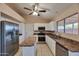 Bright kitchen featuring stainless appliances, granite countertops, and a central island at 825 E Michigan Ave, Phoenix, AZ 85022