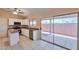 Open kitchen featuring stainless steel appliances and sliding glass doors to the backyard at 825 E Michigan Ave, Phoenix, AZ 85022
