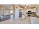 Spacious kitchen features white cabinetry, stainless steel appliances, and a central island at 825 E Michigan Ave, Phoenix, AZ 85022