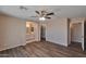 Spacious main bedroom with wood floors, ceiling fan, a walk-in closet and attached bath at 825 E Michigan Ave, Phoenix, AZ 85022