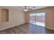 Bright main bedroom with wood floors, ceiling fan and a sliding glass door to the patio at 825 E Michigan Ave, Phoenix, AZ 85022