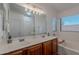 Bathroom featuring double sinks, a soaking tub, and stylish fixtures for relaxation at 830 S Cerise --, Mesa, AZ 85208