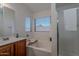 Bright bathroom with a soaking tub, separate shower, and vanity with a modern design at 830 S Cerise --, Mesa, AZ 85208