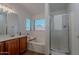 Bathroom showcasing a soaking tub, glass-enclosed shower, and modern vanity for a spa-like experience at 830 S Cerise --, Mesa, AZ 85208