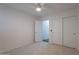 Comfortable bedroom features a ceiling fan, carpet, closet, and an access door to another room at 830 S Cerise --, Mesa, AZ 85208