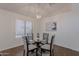 Dining room with a glass table, four chairs, neutral decor, and lots of natural light at 830 S Cerise --, Mesa, AZ 85208
