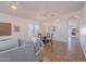 Open-concept dining area with stylish chandelier, table, and view to living room at 830 S Cerise --, Mesa, AZ 85208