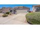 Charming single-story home with a two-car garage, desert landscaping, and a well-maintained front yard at 830 S Cerise --, Mesa, AZ 85208