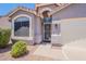 Close up of a tidy home entrance with a security screen door and manicured landscaping at 830 S Cerise --, Mesa, AZ 85208