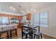 Kitchen view showcasing stainless steel appliances, wood cabinetry and an adjacent eat-in breakfast nook at 830 S Cerise --, Mesa, AZ 85208