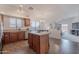 Open kitchen featuring an island, stainless steel appliances, and seamless integration with the living area at 830 S Cerise --, Mesa, AZ 85208