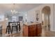 Bright kitchen featuring an island, breakfast table with seating, and open floor plan to living room at 830 S Cerise --, Mesa, AZ 85208