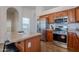 Kitchen featuring stainless steel appliances, an island, and ample cabinet space at 830 S Cerise --, Mesa, AZ 85208