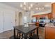 Spacious kitchen featuring a central island, stainless steel appliances, and an adjacent breakfast table at 830 S Cerise --, Mesa, AZ 85208