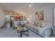 Bright living room with modern decor, plush seating, and open layout to the kitchen at 830 S Cerise --, Mesa, AZ 85208
