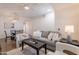 Bright living room with modern furniture, ceiling fan, and open layout to dining at 830 S Cerise --, Mesa, AZ 85208