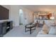 Inviting living room with plush seating, media center, and seamless flow to the adjacent rooms at 830 S Cerise --, Mesa, AZ 85208