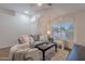 Comfortable living room with neutral tones, modern furnishings, and a large window at 830 S Cerise --, Mesa, AZ 85208