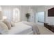 Well-lit bedroom featuring carpet, a plush bed, and ensuite bathroom for enhanced privacy and convenience at 830 S Cerise --, Mesa, AZ 85208