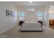 Serene bedroom with arched window, soft lighting, and carpet flooring for ultimate comfort at 830 S Cerise --, Mesa, AZ 85208