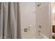 Close up of bathroom shower/tub combo with tile surround and shower curtain at 830 S Cerise --, Mesa, AZ 85208