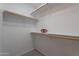 Spacious walk-in closet featuring shelving and natural light; perfect for organized storage at 830 S Cerise --, Mesa, AZ 85208