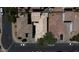 An aerial view showing the brown roofs, driveways and landscaping of the neighborhood at 8516 N 64Th Ave, Glendale, AZ 85302
